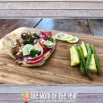 This easy grilled gyros and vegetable recipe is PERFECT for summer! No fuss, no mess, and can all be done outside on the grill! Check out the smart way to make the marinade too!